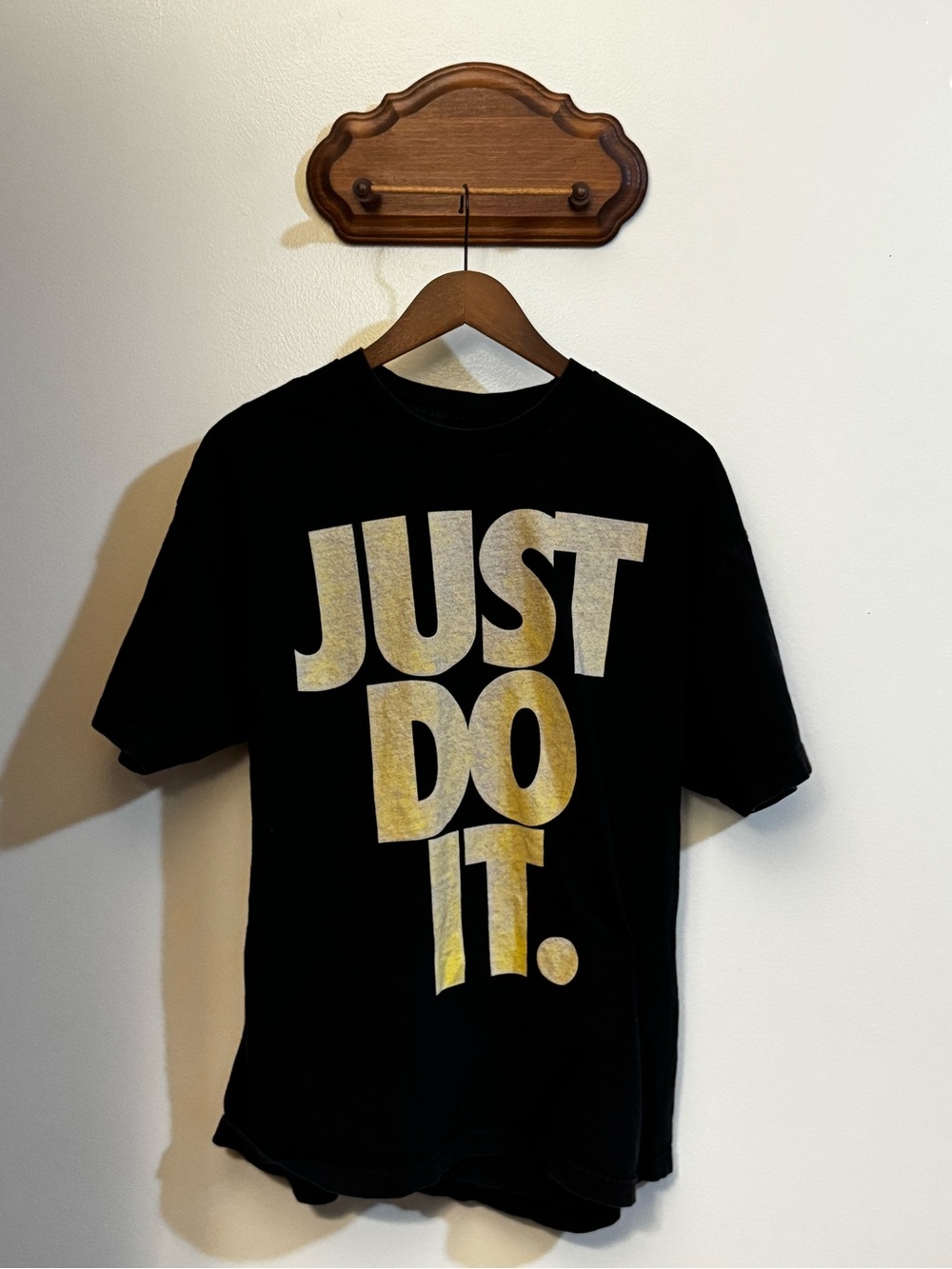 Nike Kids Black Tee with Bold Gold "Just Do It." Graphic